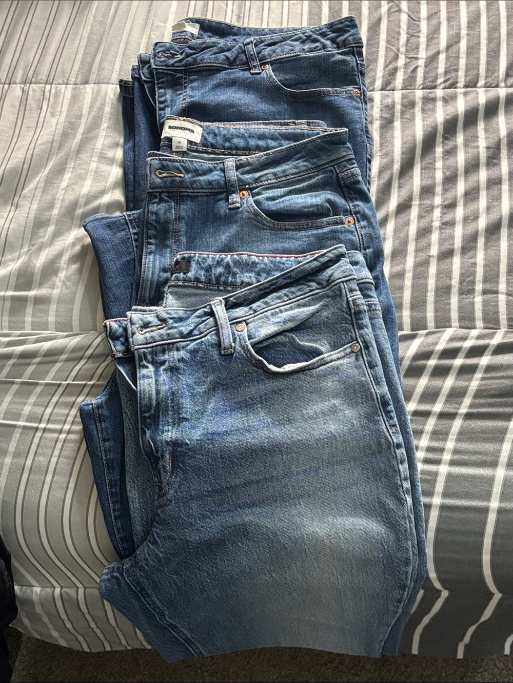 Stack of Blue Denim Jeans - Multiple Pairs